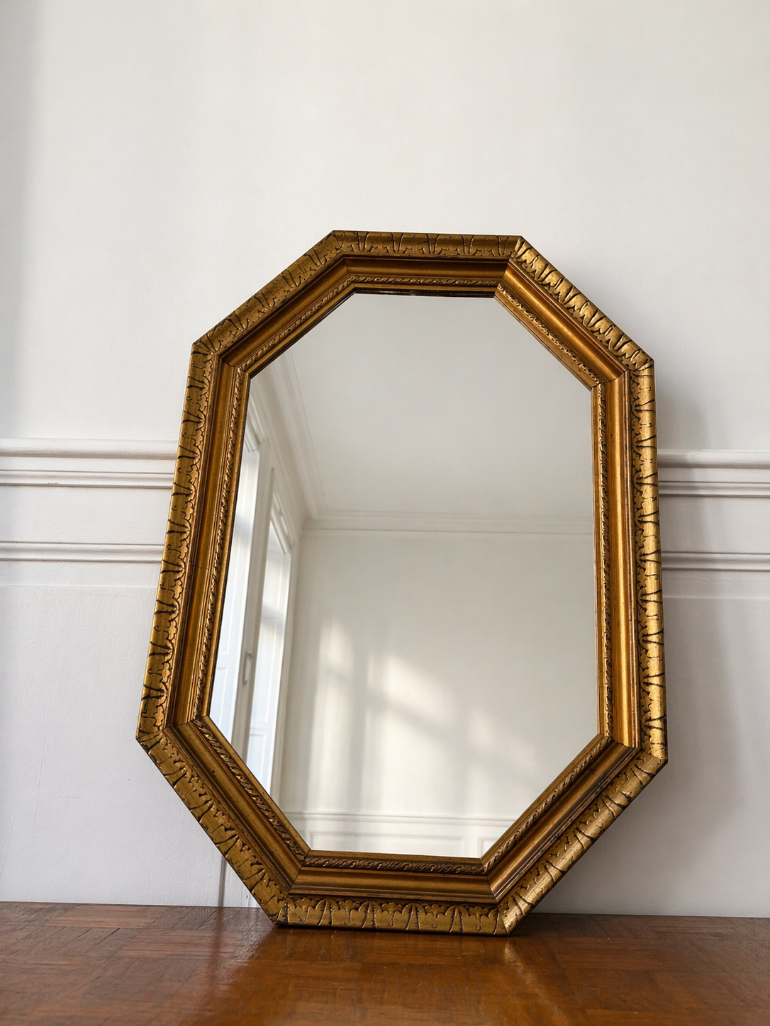 Miroir octogonal doré aux reflets cuivré