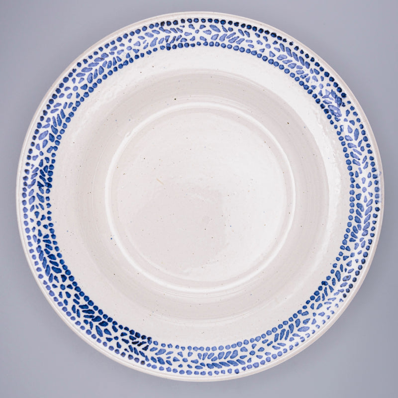 Blue and white speckled deep plates from Razzia Days, featuring a classic ceramic design ideal for dinnerware.