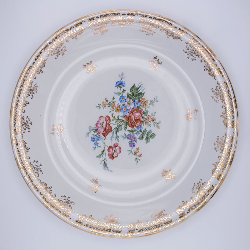 Set of four large Limoges porcelain plates with elegant chiadée design by Razzia Days, displayed on a neutral background.