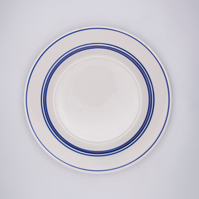 Set of petite blue rimmed plates by Razzia Days, featuring a delicate blue border design for elegant table settings.