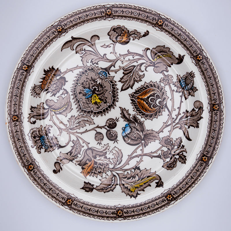 Pair of Jacobean-style English plates by Razzia Days featuring intricate floral and geometric patterns on white porcelain.