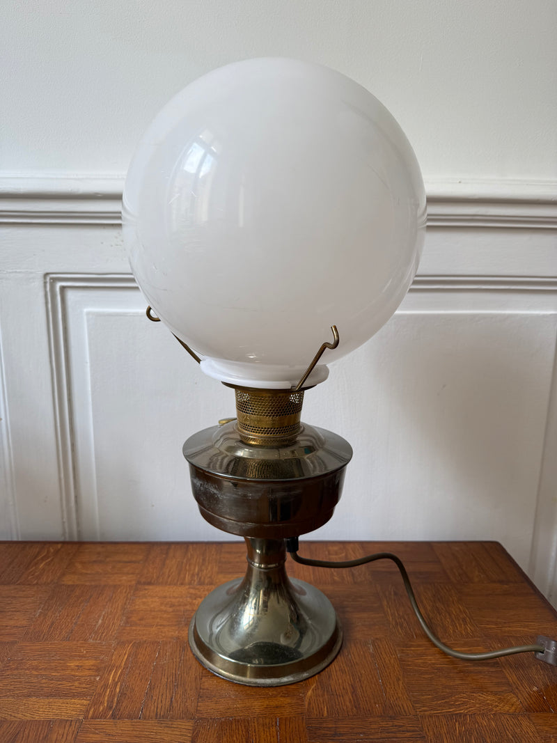 Electric Art Nouveau oil lamp by Razzia, featuring intricate decorative design and warm lighting.