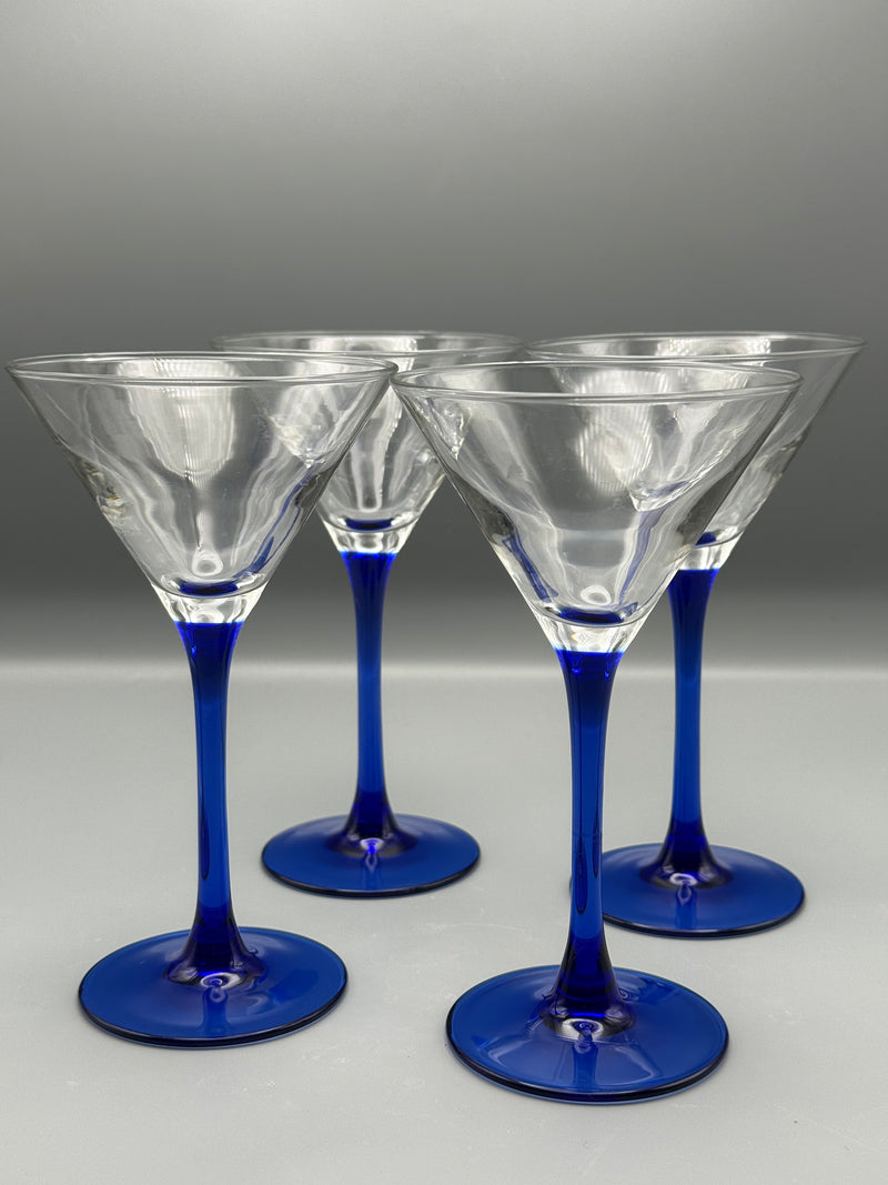 Set of four Luminarc Razzia Days cocktail glasses with colorful geometric patterns, shown on a white background.