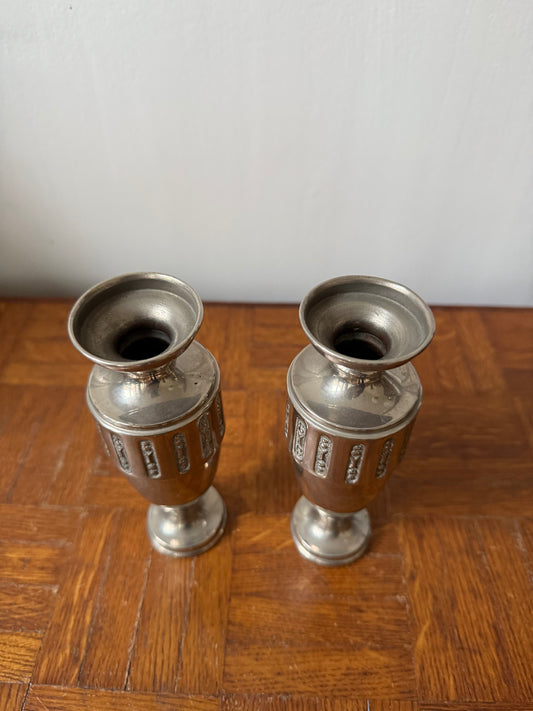 Pair of Art Deco silver metal vases with sleek geometric design, ideal for elegant home decor displays.