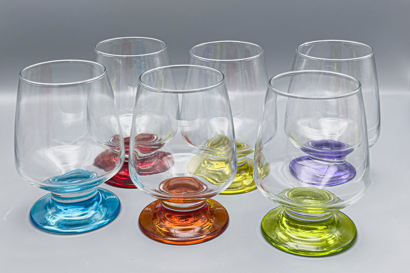 Colorful Razzia Days water glasses with vibrant painted feet, showcasing a set of decorative and playful drinking glasses.