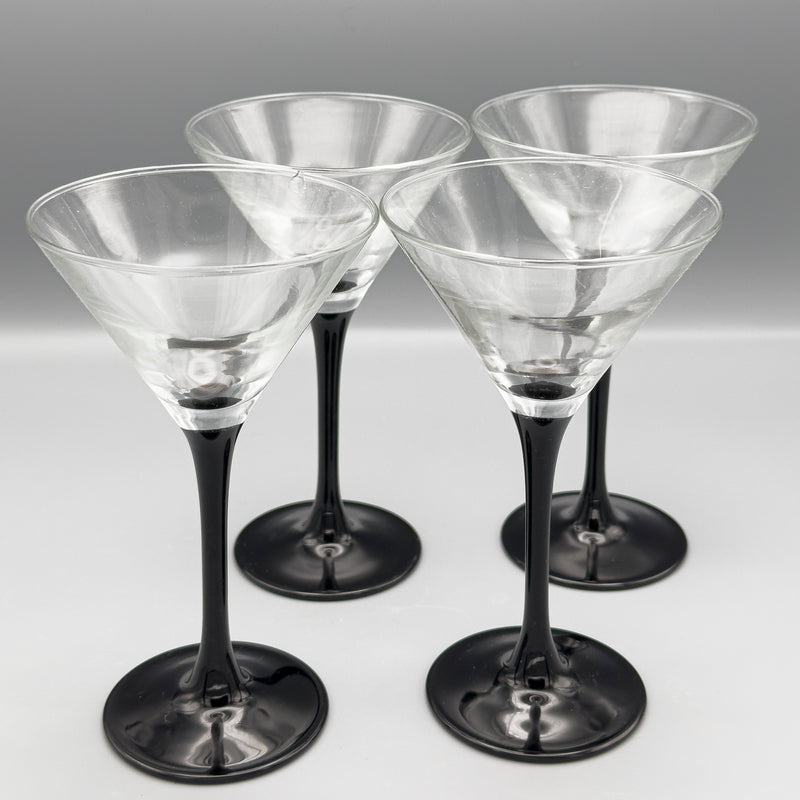Luminarc pied noir cocktail glasses with tall, elegant design, featuring a sleek black base and clear glass bowl for stylish drinks.