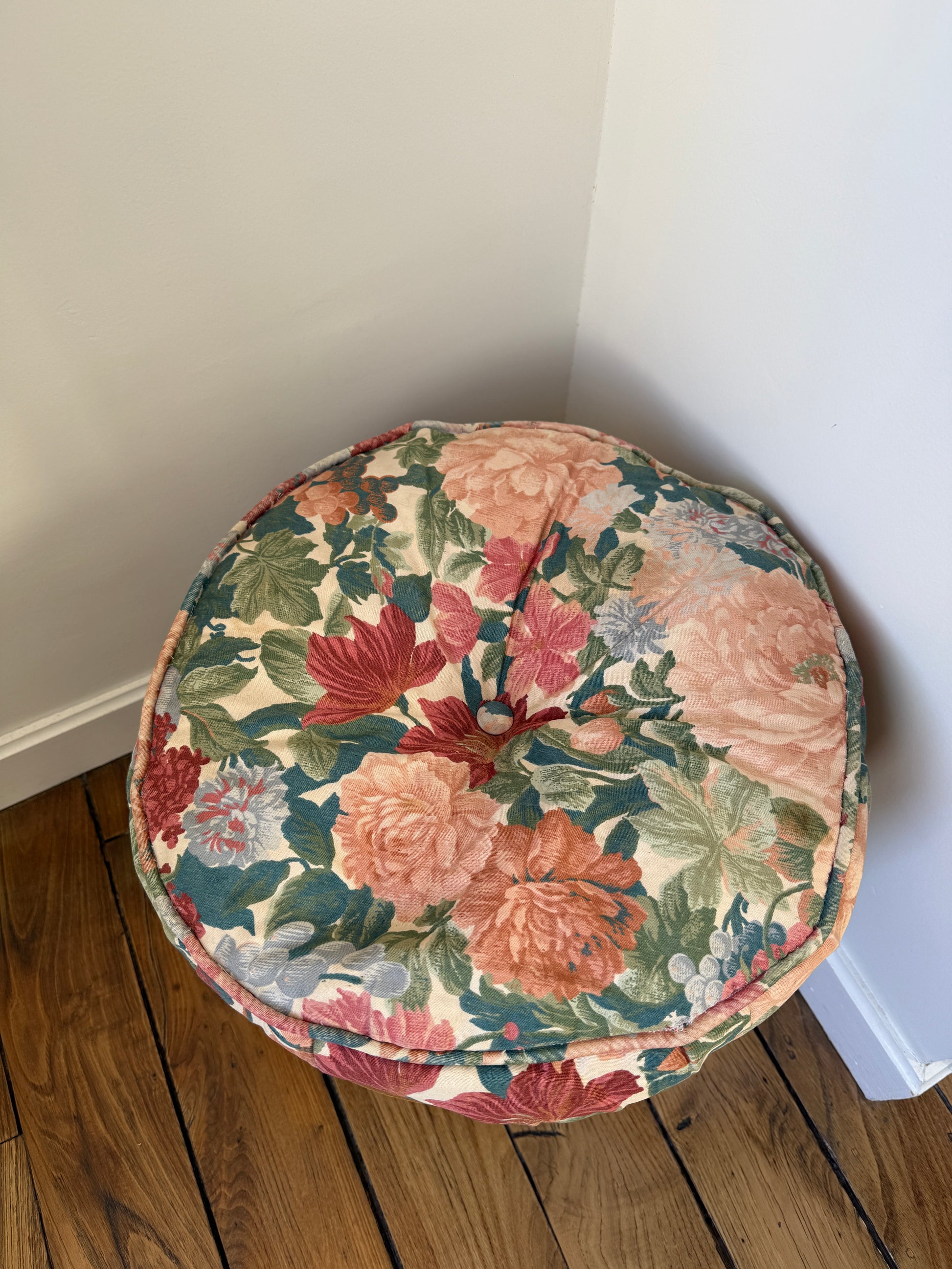 Vintage Razzia rattan stool with a fabric cushion, showcasing a stylish and natural design for versatile seating.