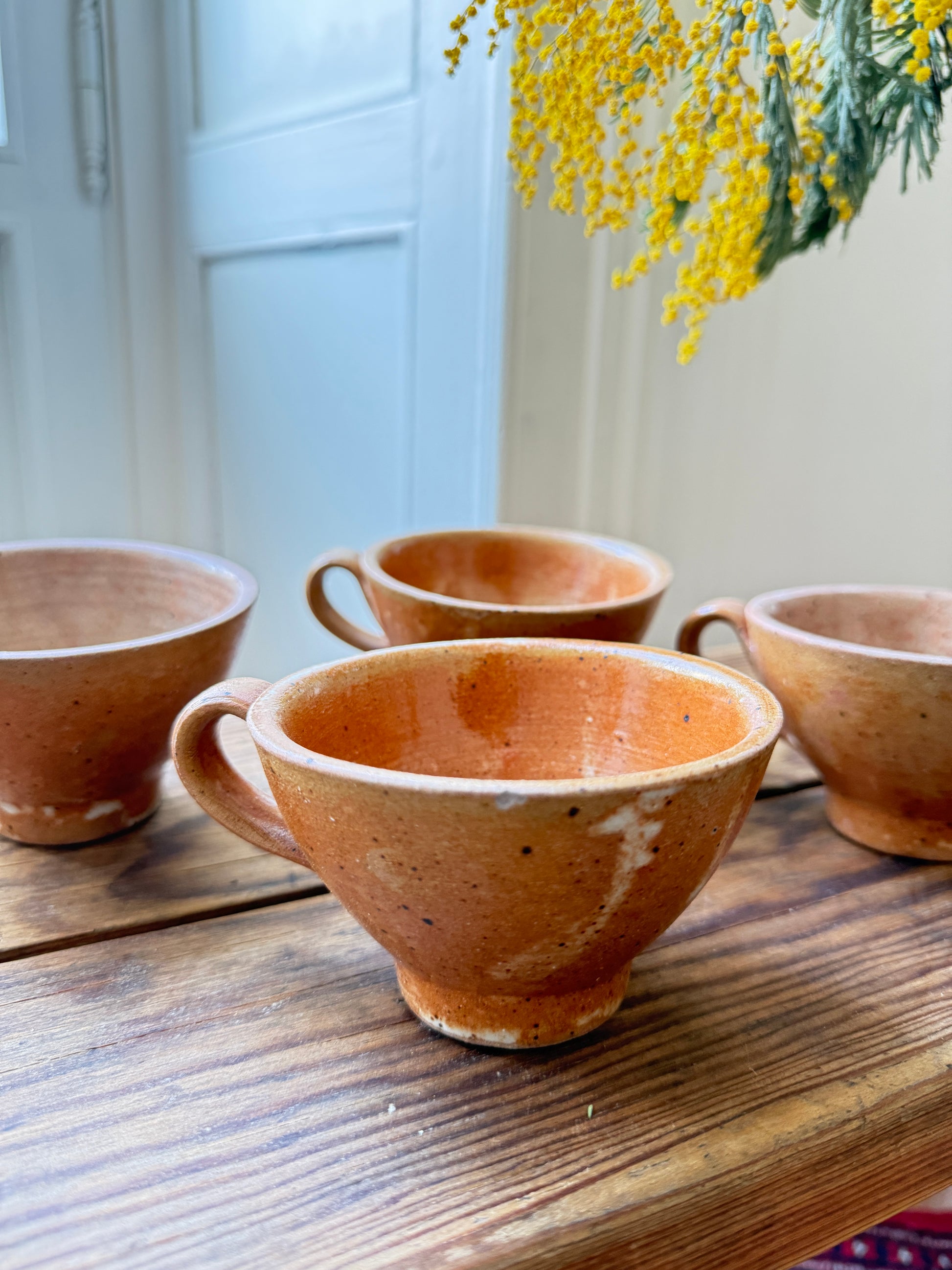 Set of four Razzia artisanal stoneware mugs with rustic, handcrafted design and natural glaze, perfect for everyday use.