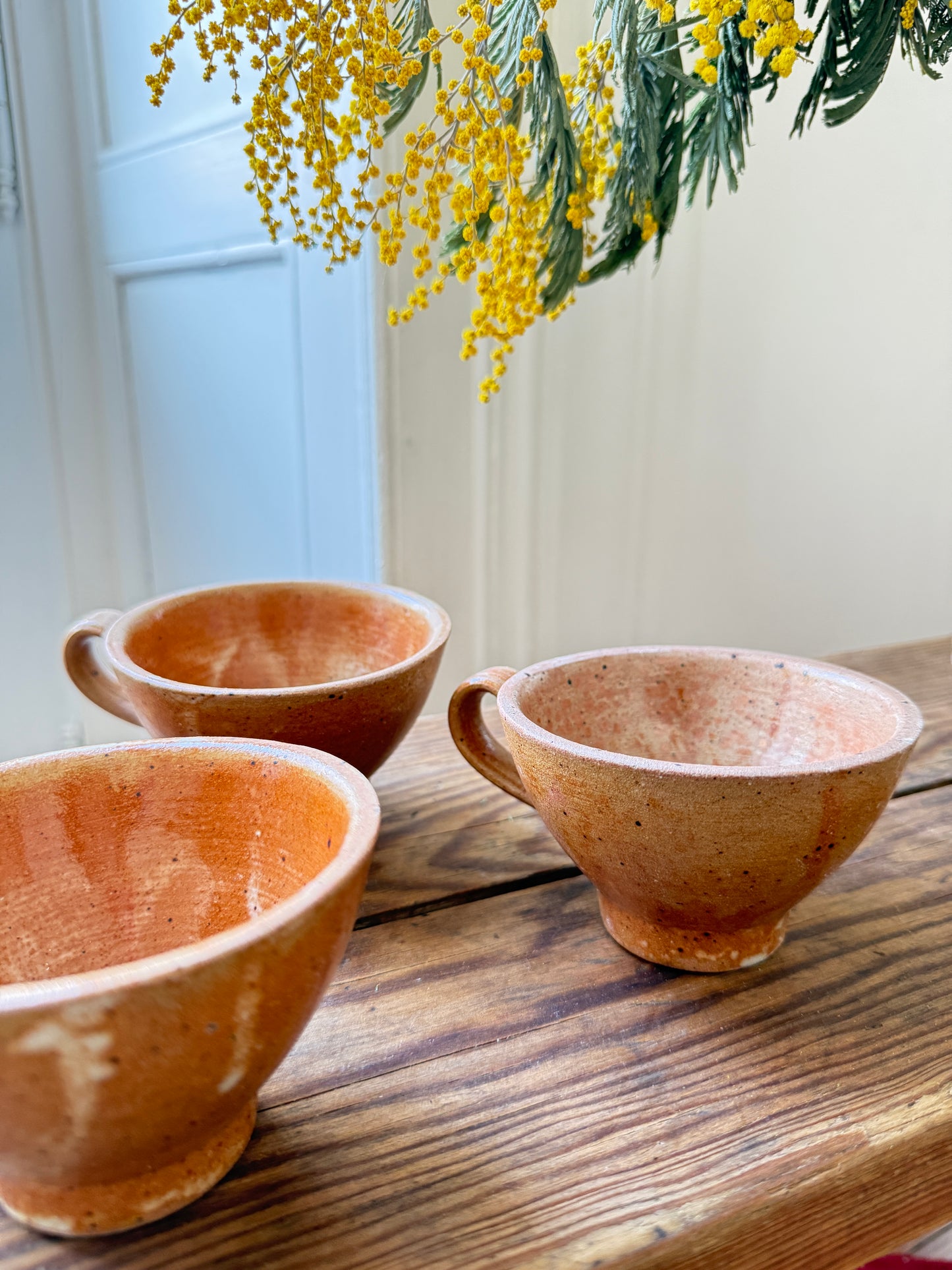 Set of four Razzia artisanal stoneware mugs with rustic, handcrafted design and natural glaze, perfect for coffee or tea.