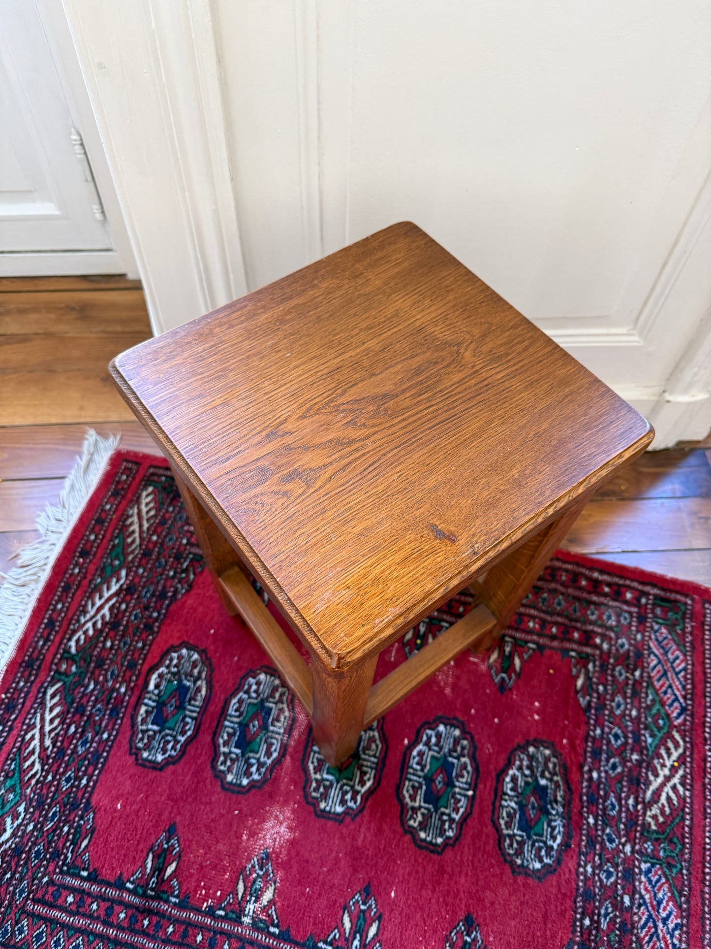 Brutalist wooden stool by Razzia featuring a solid, minimalist design with natural wood grain and sturdy construction.