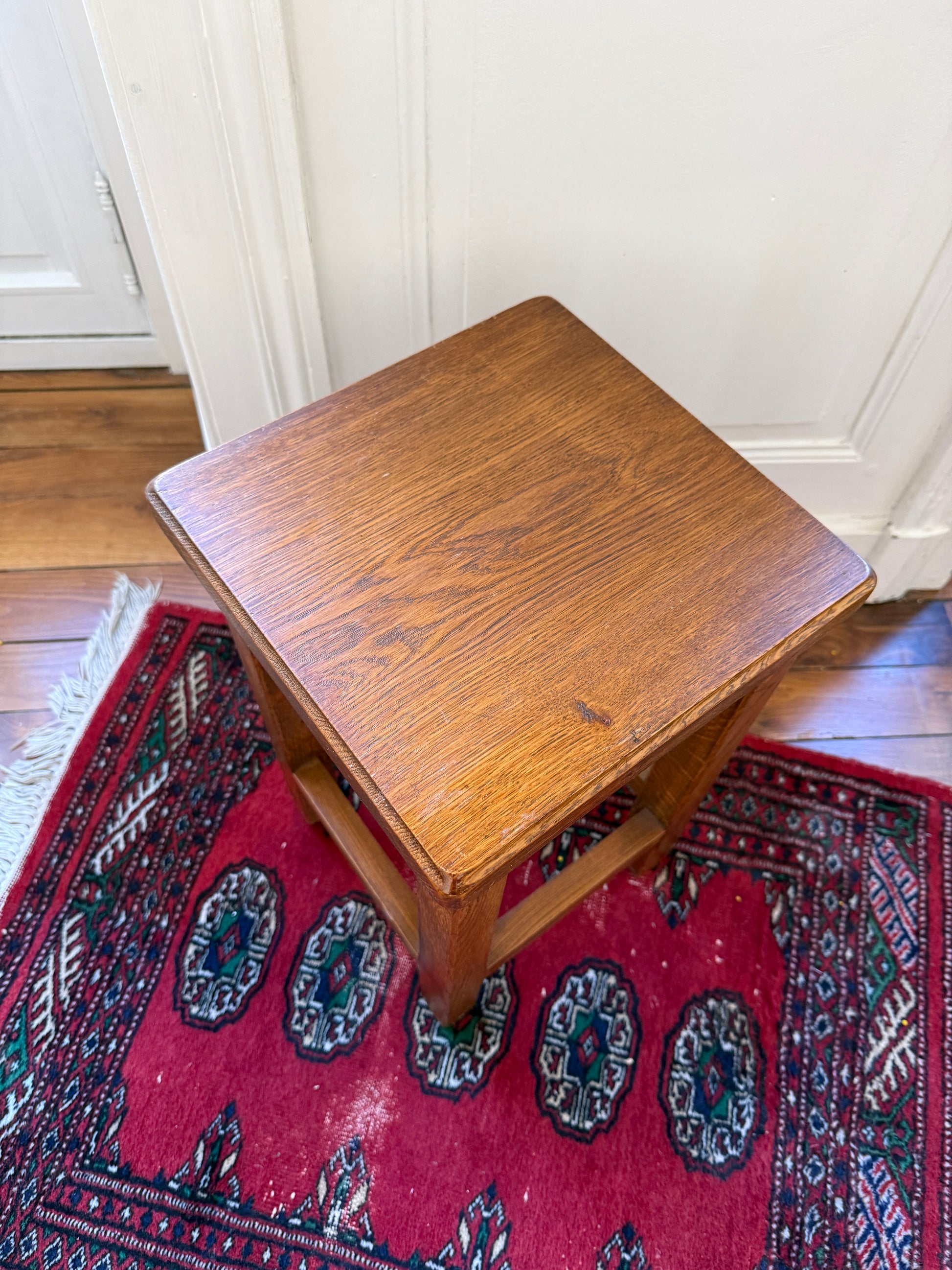 Brutalist wooden stool by Razzia featuring a solid, minimalist design with natural wood grain and sturdy construction.