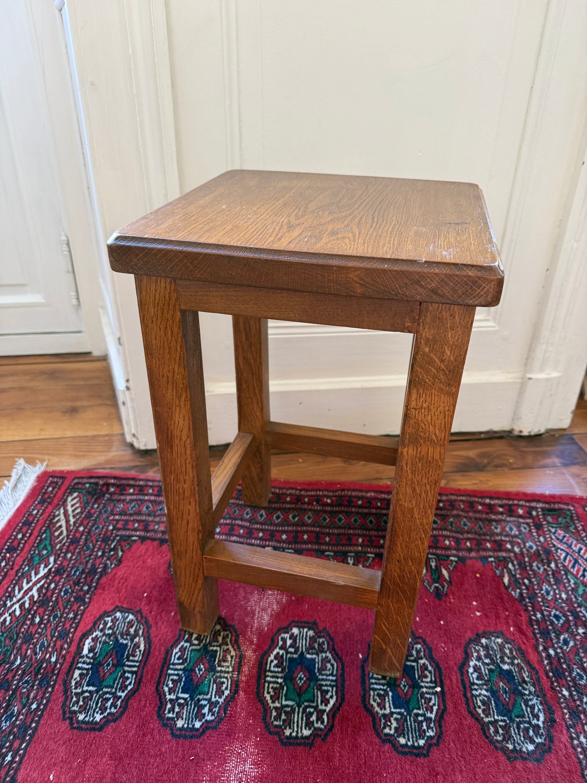 Brutalist wooden stool by Razzia featuring a minimalist design and natural wood finish.