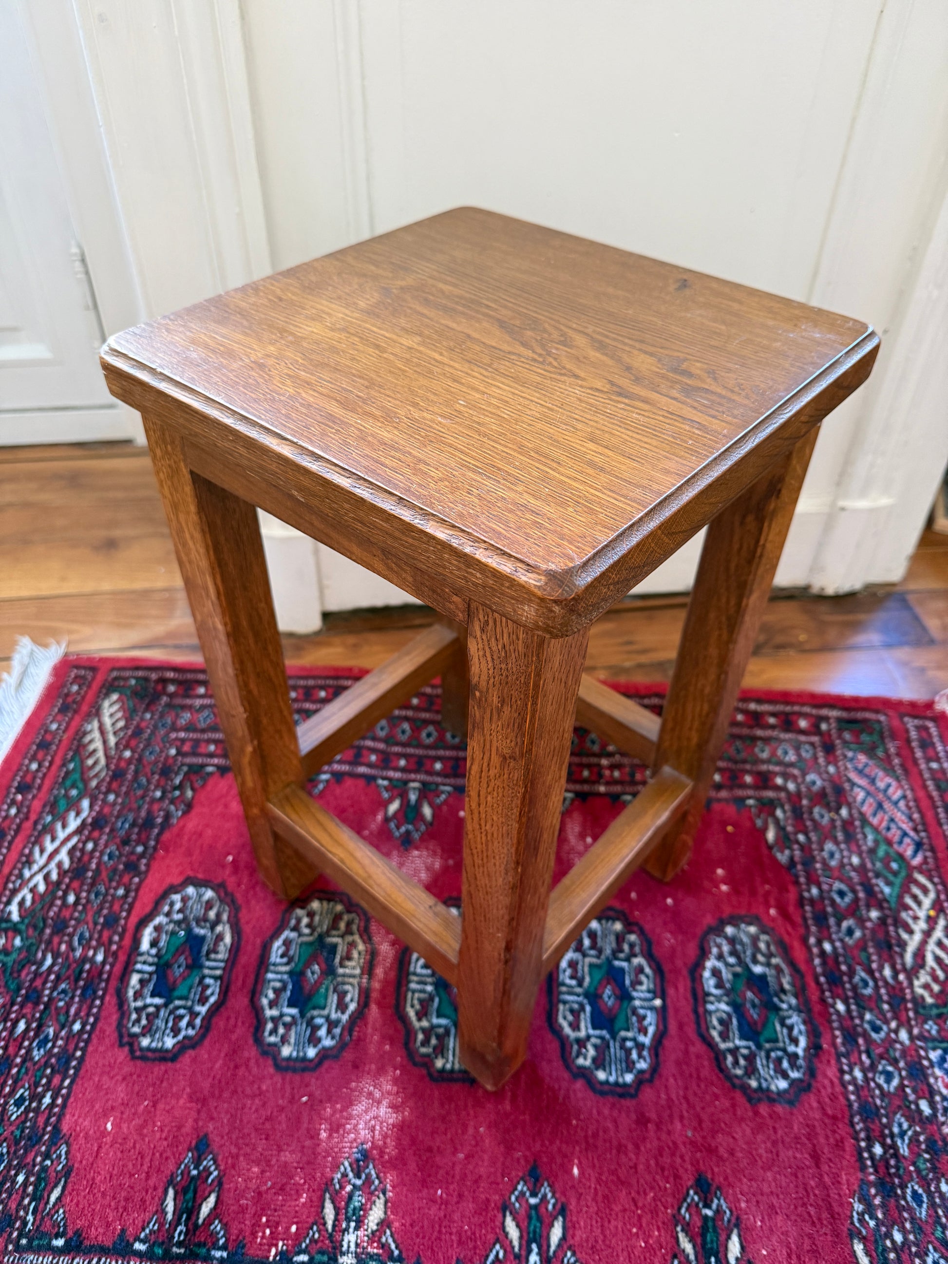 Brutalist wooden tabouret by Razzia featuring a minimalist design and natural wood finish, suitable as a stylish accent piece.