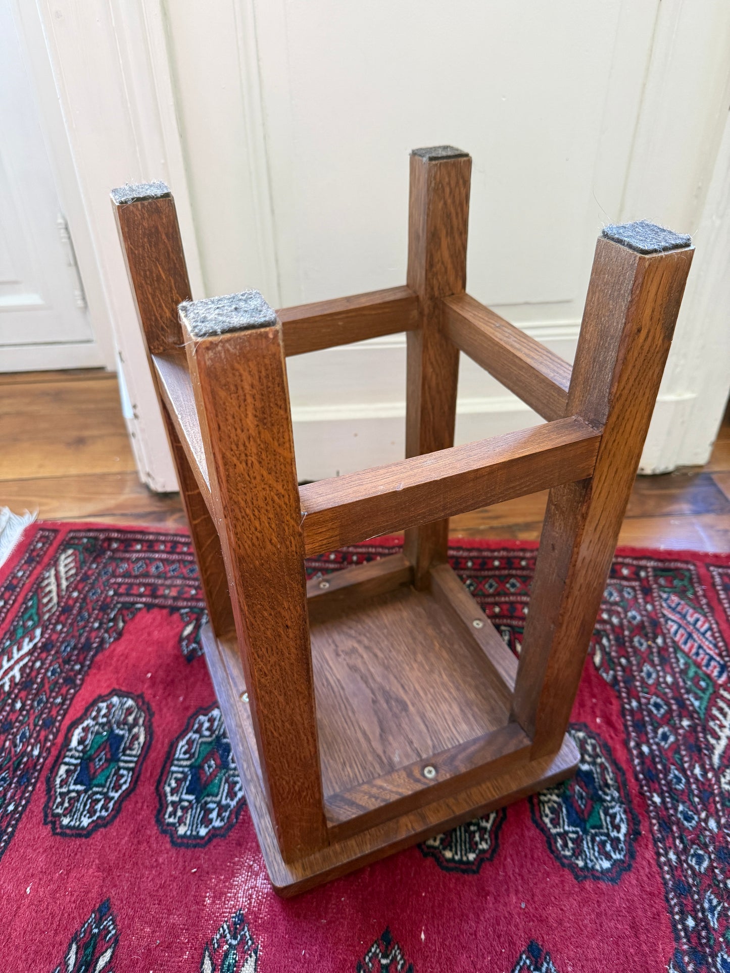 Wooden brutalist-style tabouret by Razzia with a minimalist design and natural wood finish, showcasing its sturdy, sculptural form.
