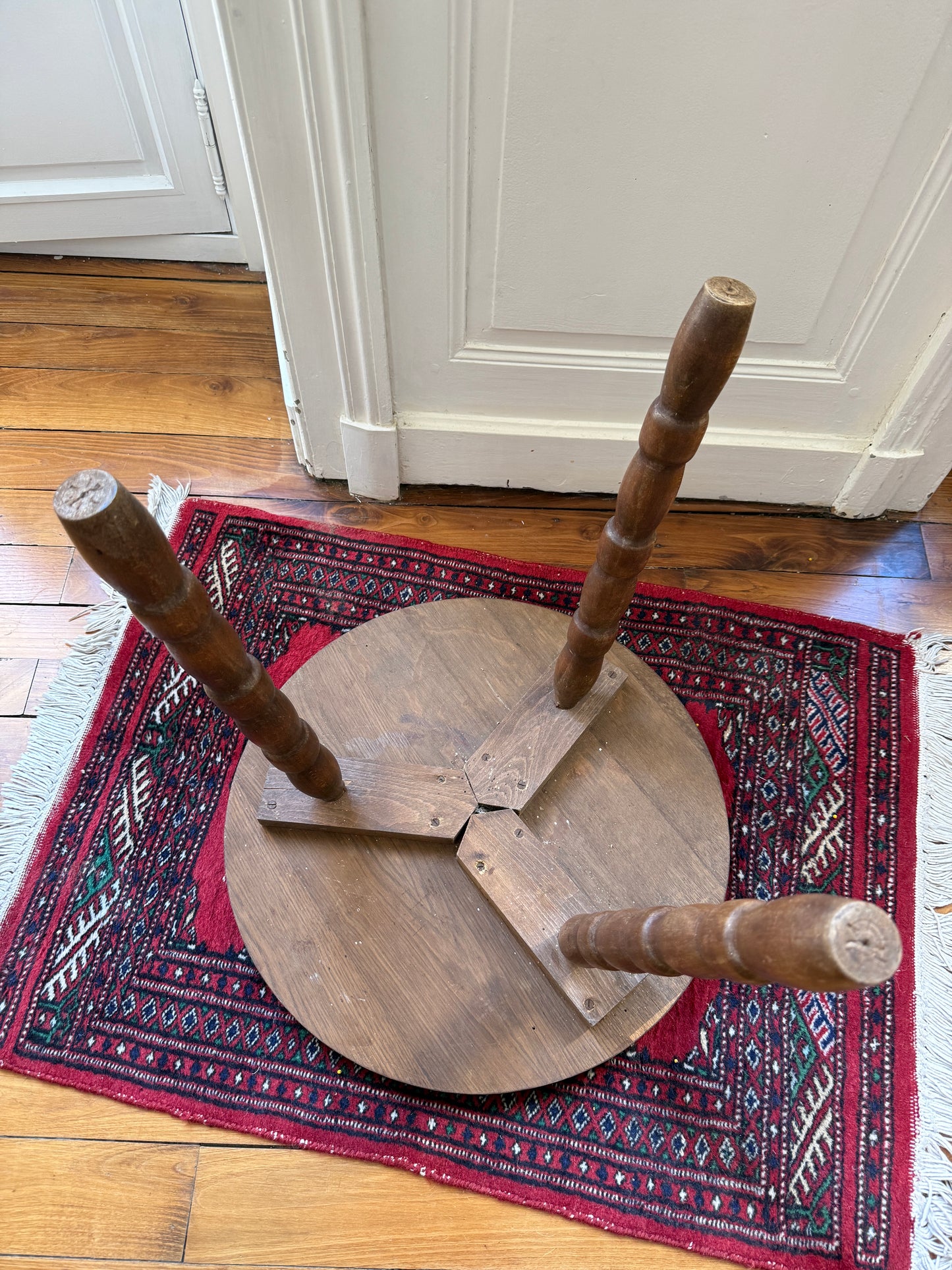 Wooden tripod side table in brutalist style by Razzia, featuring a minimalist design with natural wood finish and sturdy tripod legs.