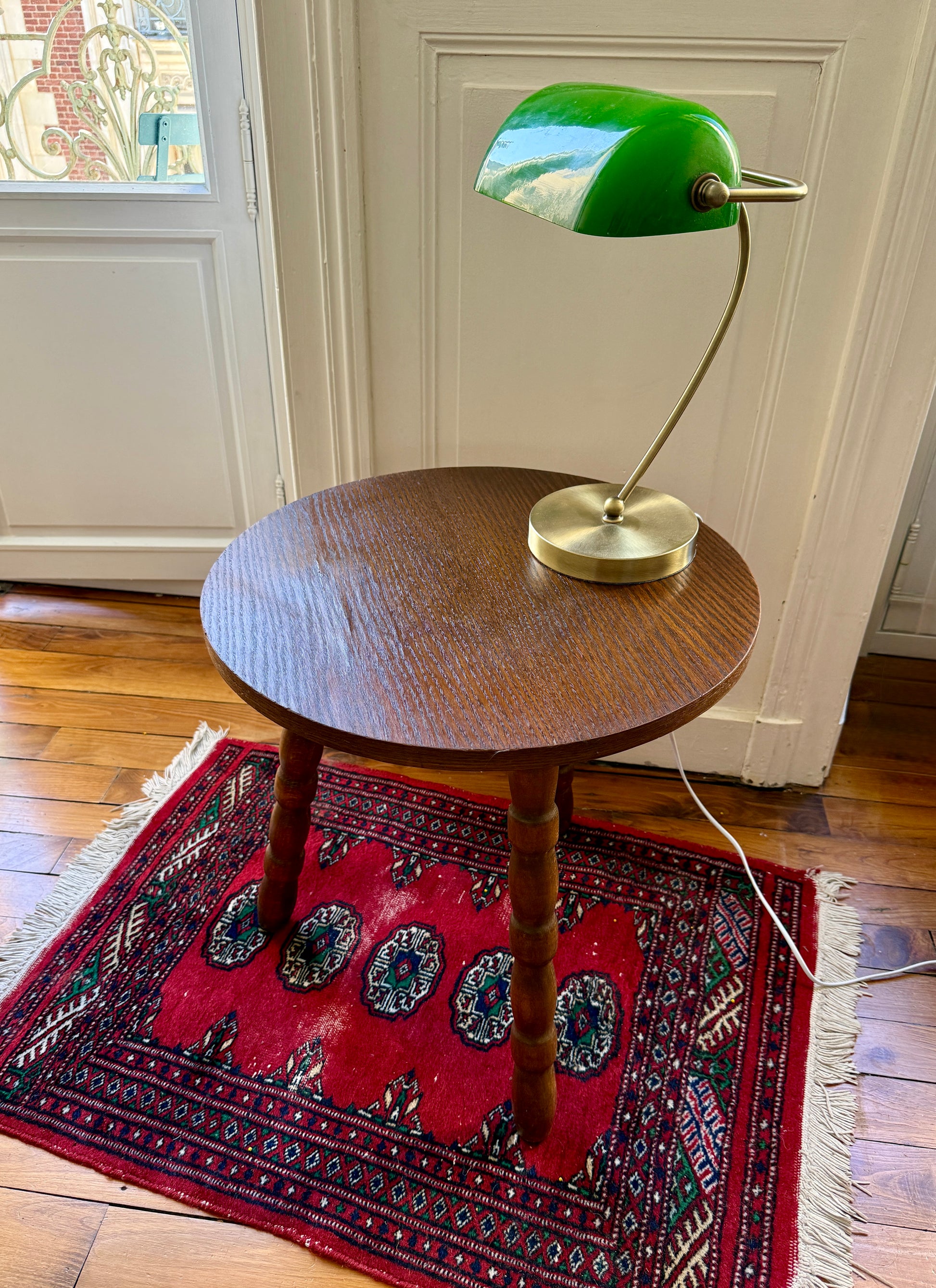 Wooden tripod side table with brutalist design by Razzia, featuring a sturdy, minimalist wooden structure and geometric shape.