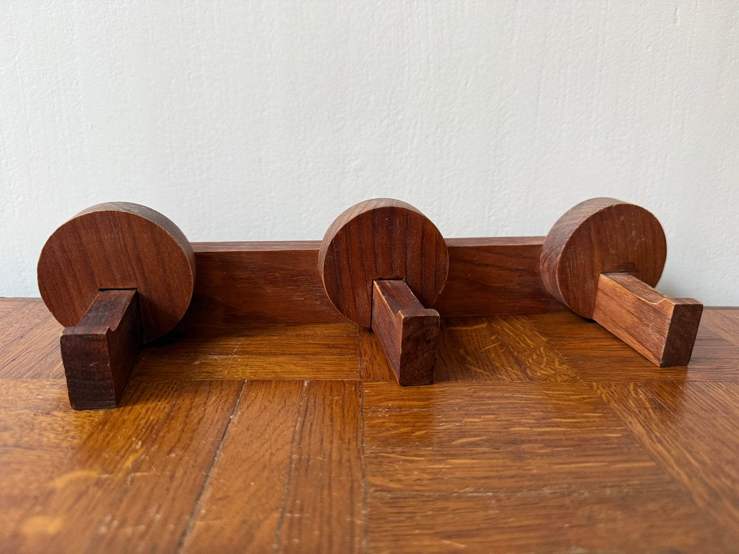 Vintage wooden coat rack from the 1960s by Razzia, featuring multiple hooks and a sleek mid-century design.