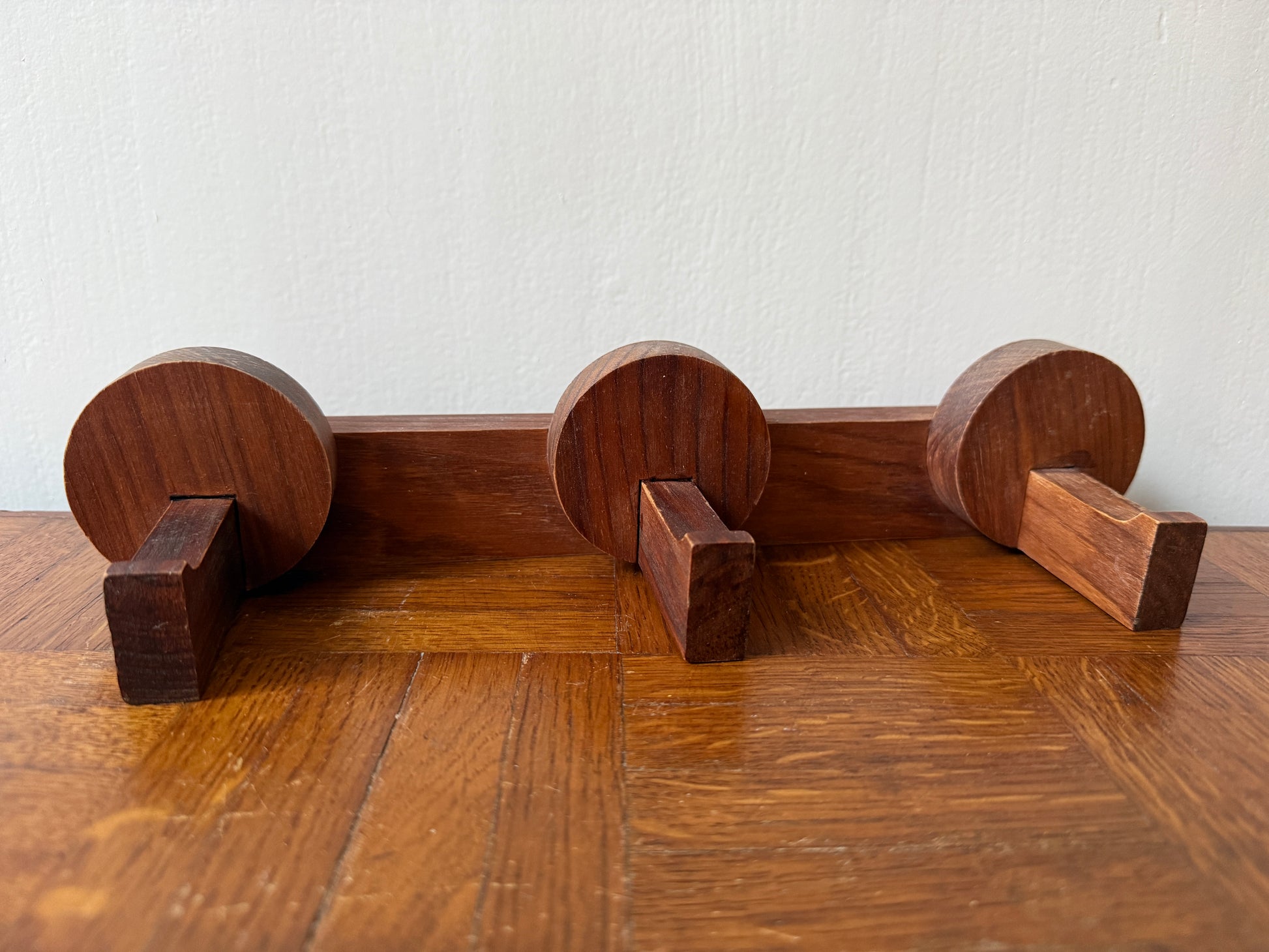 Vintage wooden coat rack from the 1960s by Razzia, featuring multiple hooks and a sleek mid-century design.