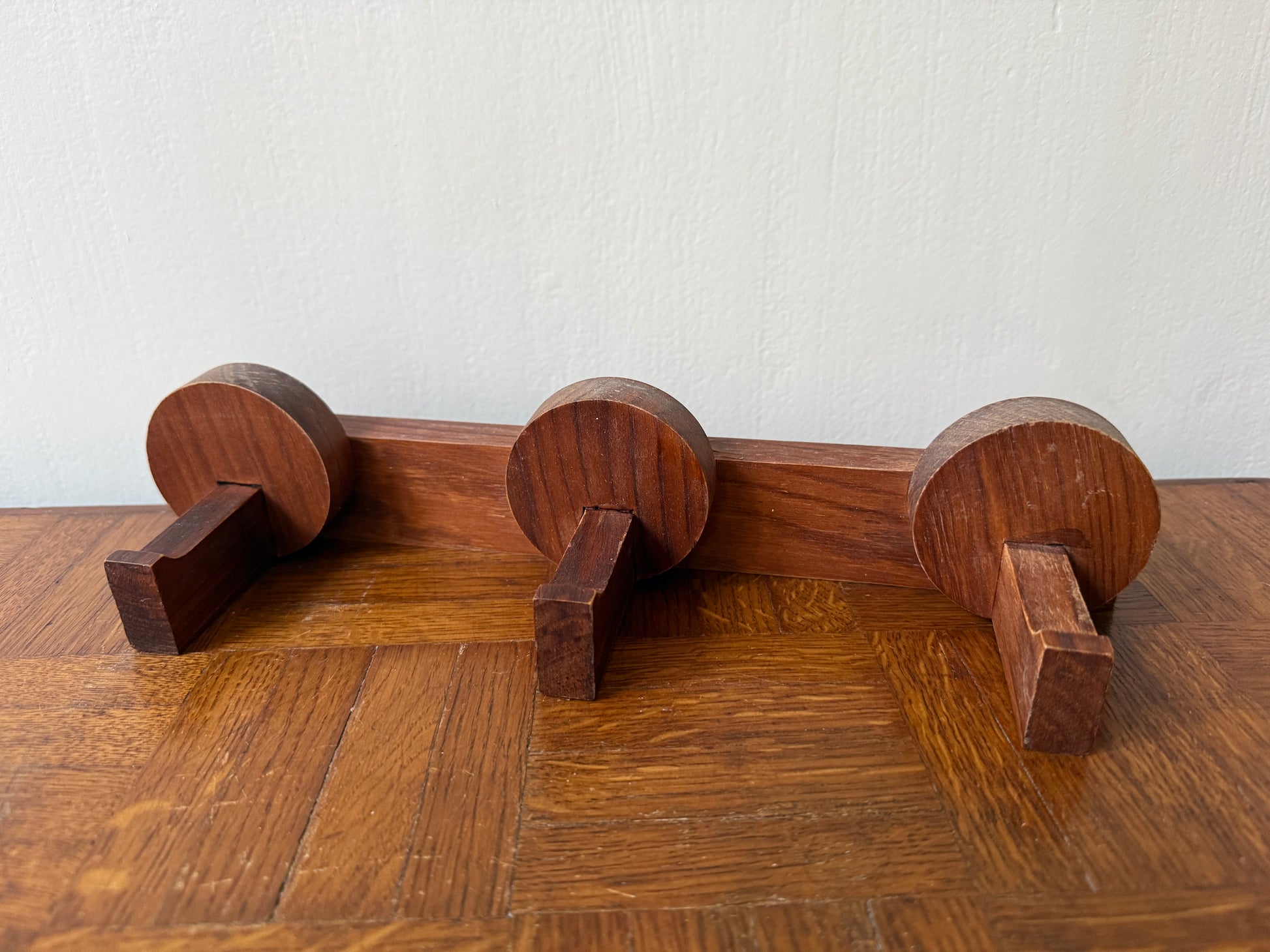 Wooden coat rack from the 1960s by Razzia, featuring a vintage design with multiple hooks on a polished wooden frame.