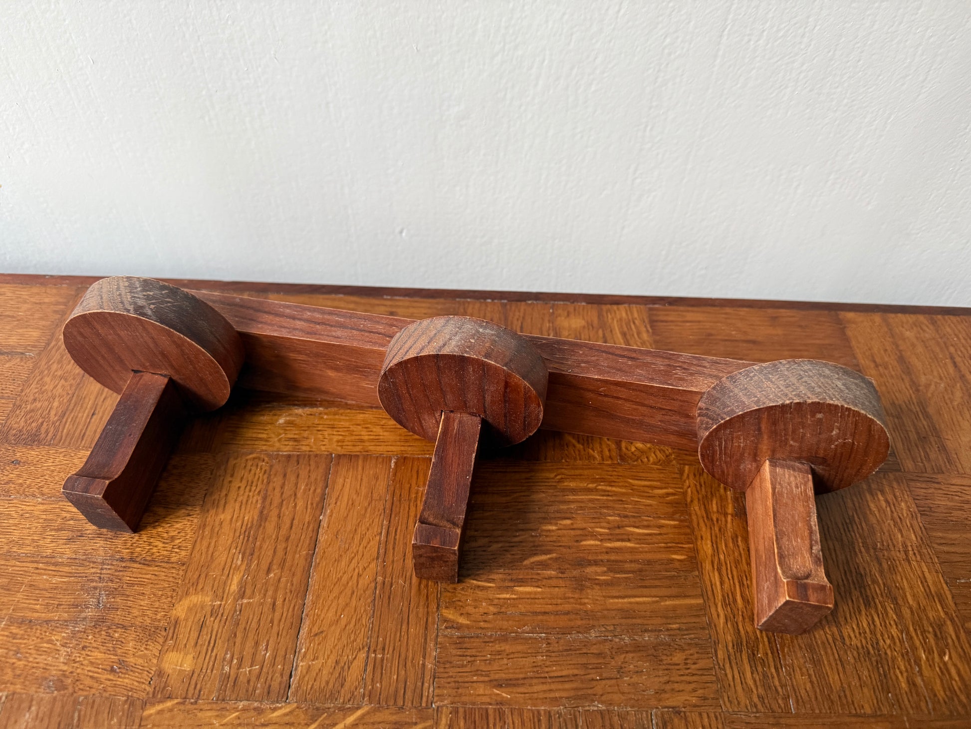Wooden coat rack from the 1960s by Razzia, featuring a vintage design with multiple hooks and a sturdy wooden frame.