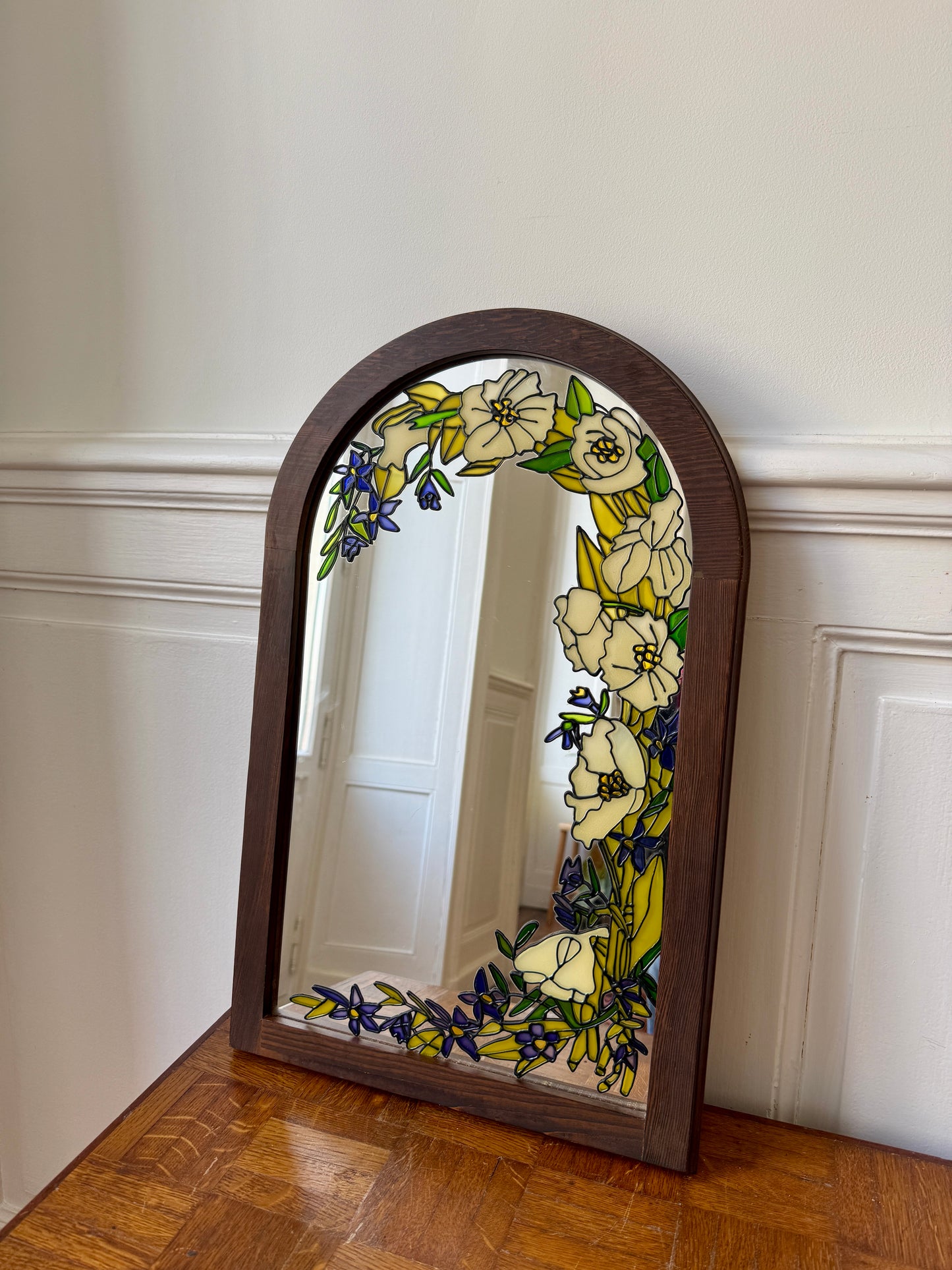 Miroir Tiffany Art Déco Razzia avec cadre ornemental en verre transparent, design élégant et sophistiqué.