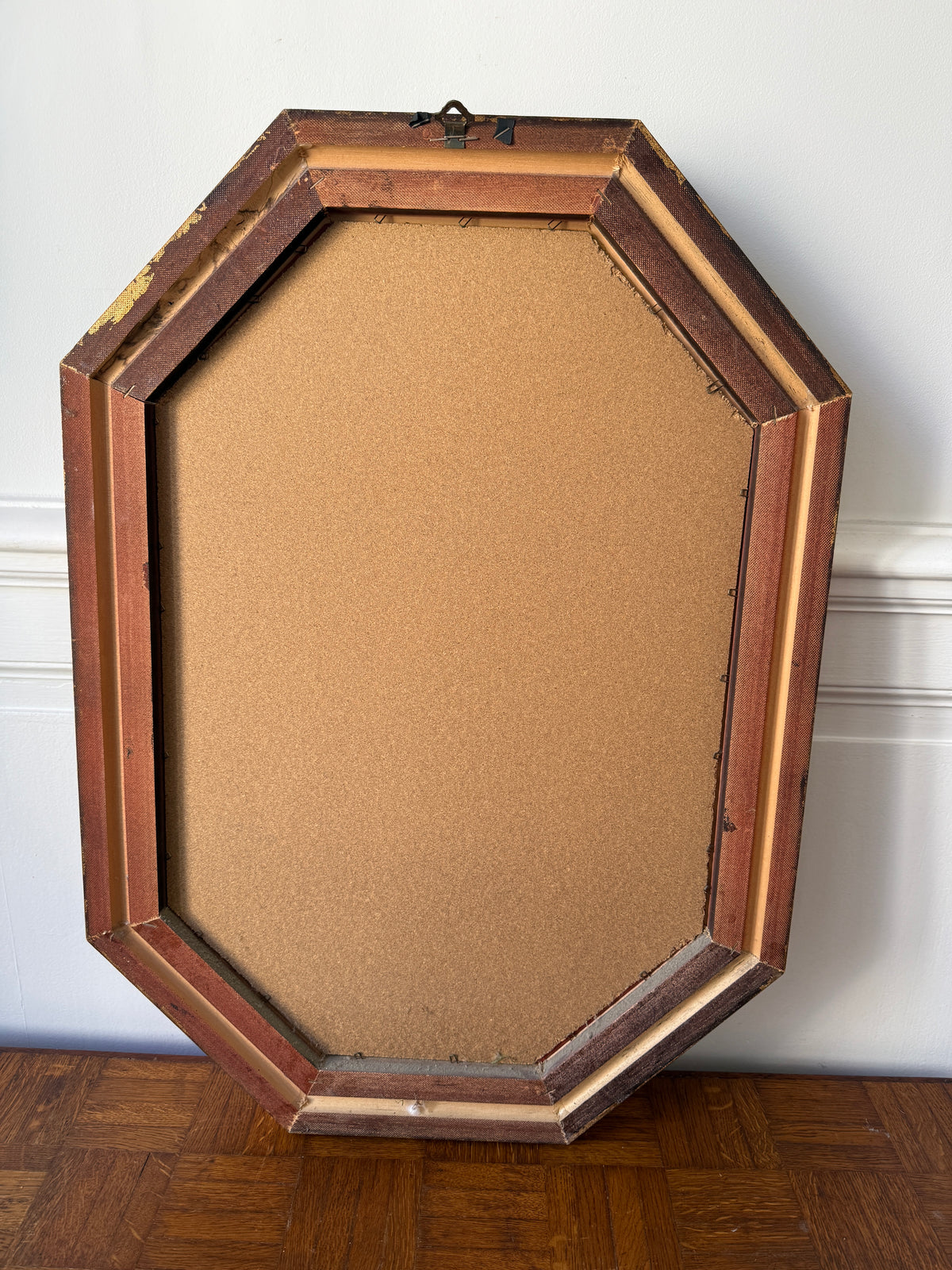 Miroir octogonal doré aux reflets cuivré
