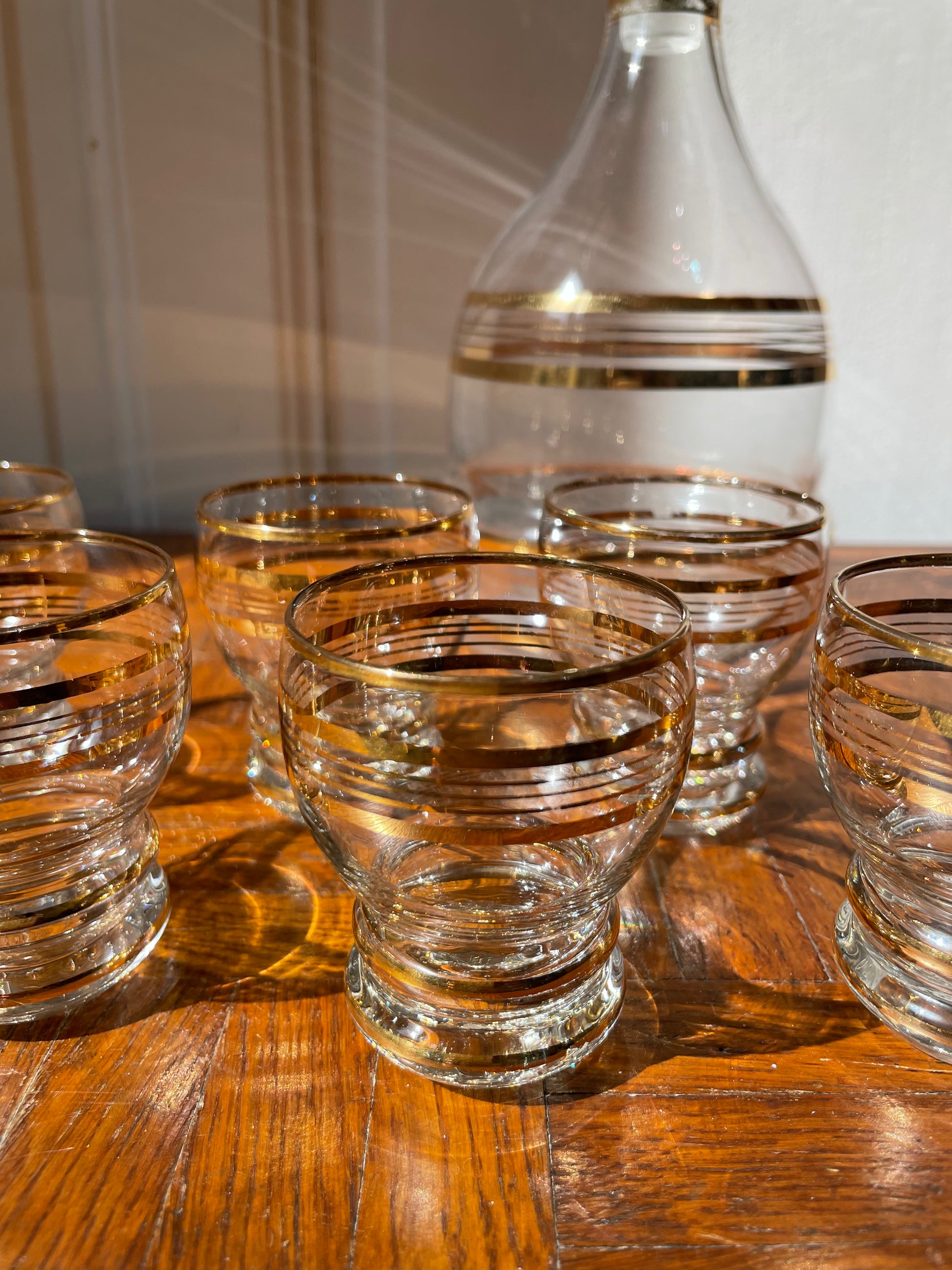 Vintage Razzia Days carafe with matching liqueur glasses, elegant glassware set for serving spirits.