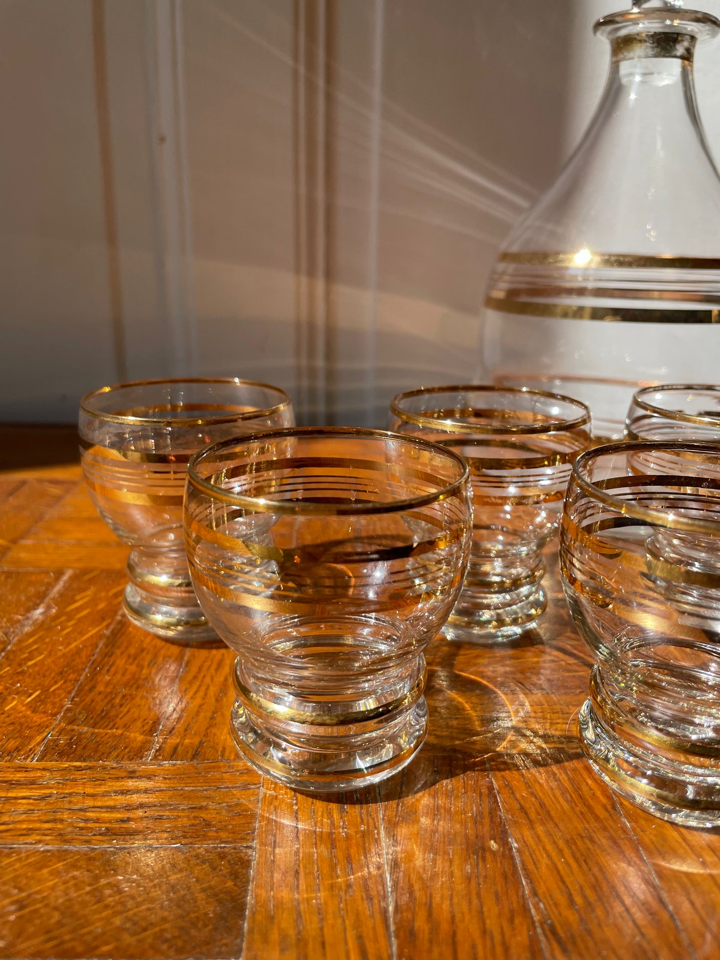 Vintage Razzia Days carafe and liqueur glasses set with clear glass and intricate design, perfect for serving spirits.
