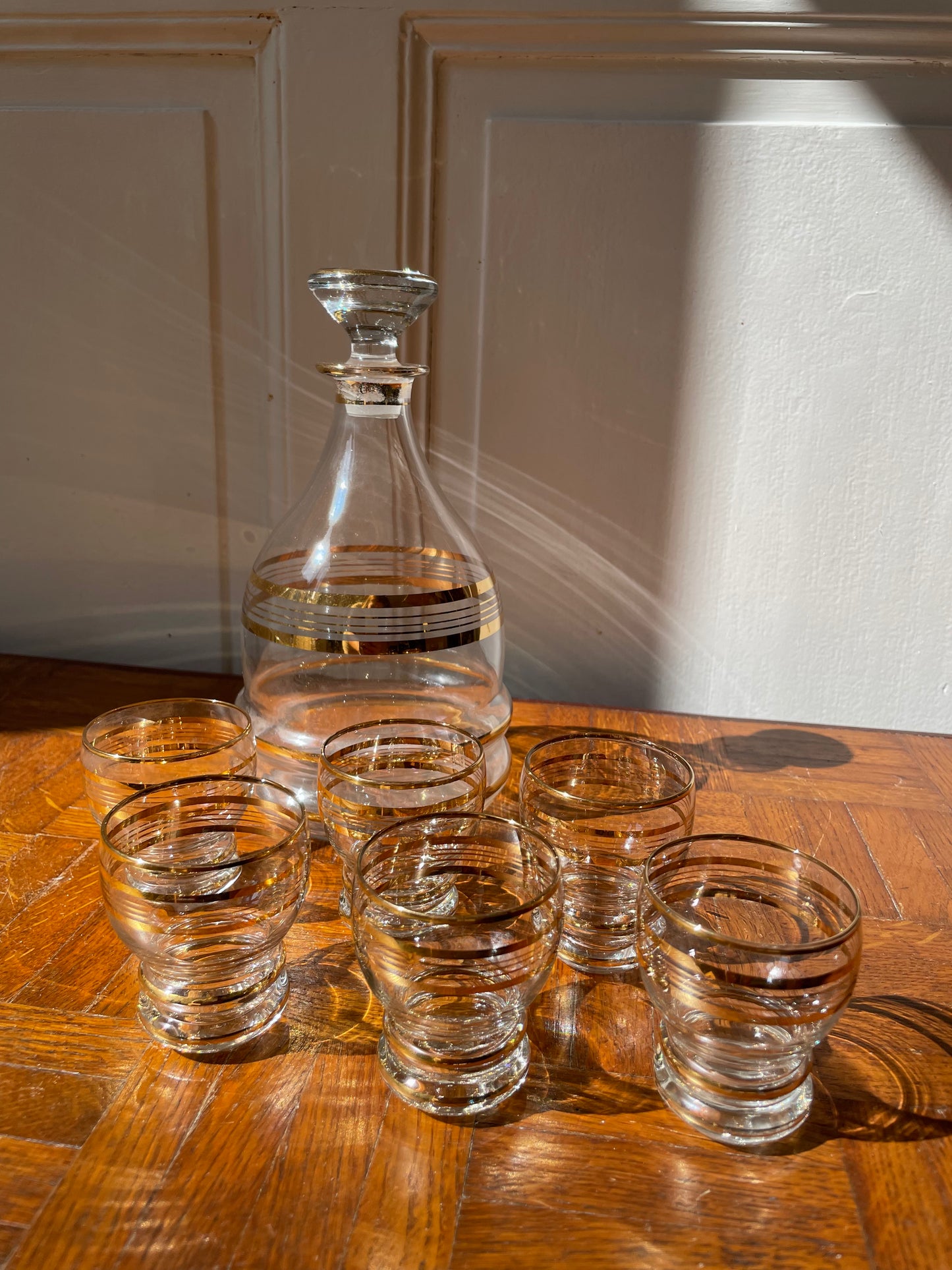 Vintage Razzia Days carafe with matching liqueur glasses, clear glass with intricate etched designs, perfect for serving spirits