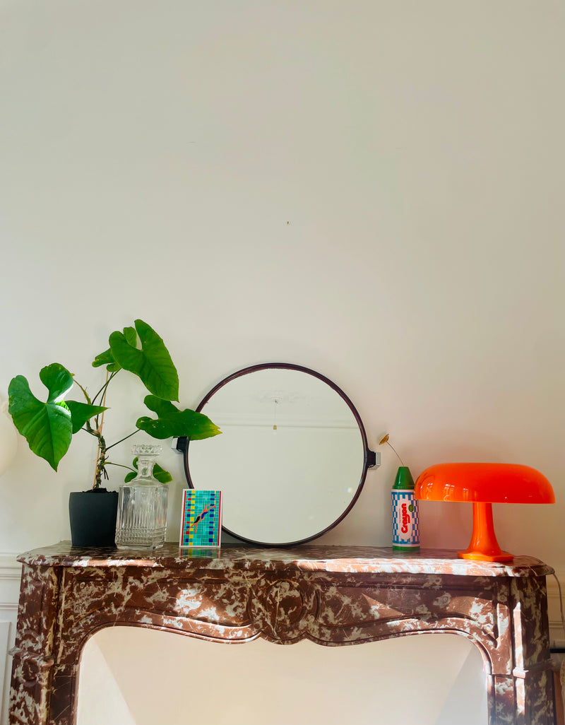Pivoting 1970s Razzia Days mirror with round frame and vintage style, featuring a sleek, reflective surface.