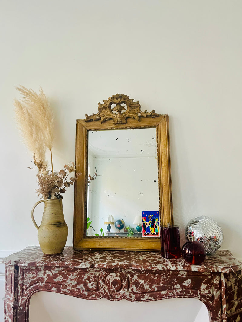 Louis XVI mercury mirror by Razzia Days, ornate antique-style mirror with detailed frame reflecting classic elegance.